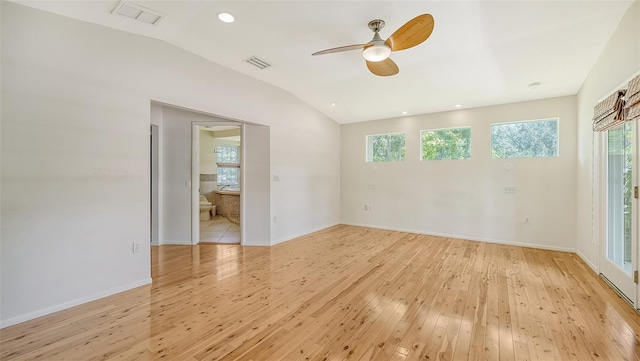 spare room featuring ceiling fan, plenty of natural light, and light hardwood / wood-style flooring