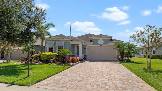 view of front facade featuring a garage and a front lawn