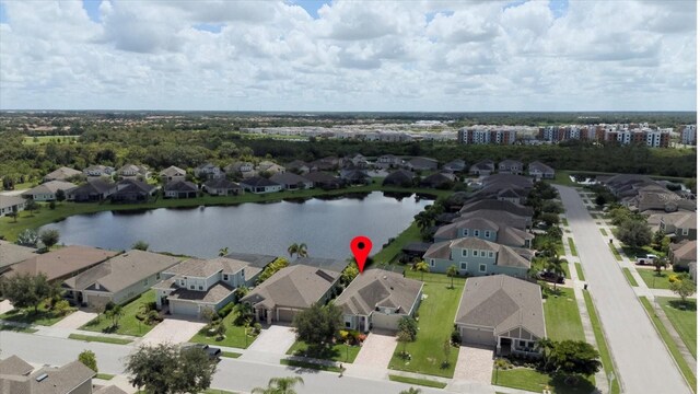 birds eye view of property featuring a water view