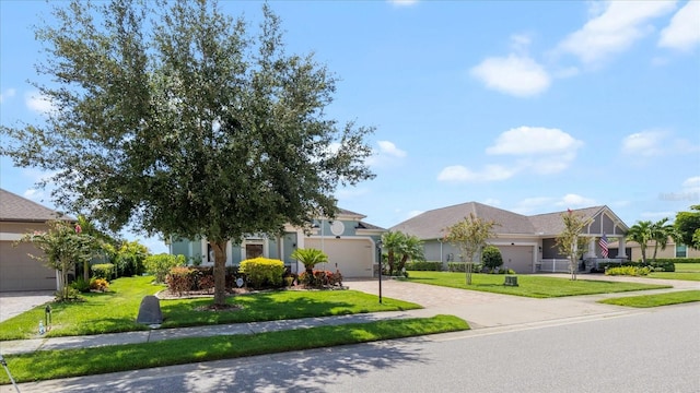 single story home featuring a garage and a front lawn