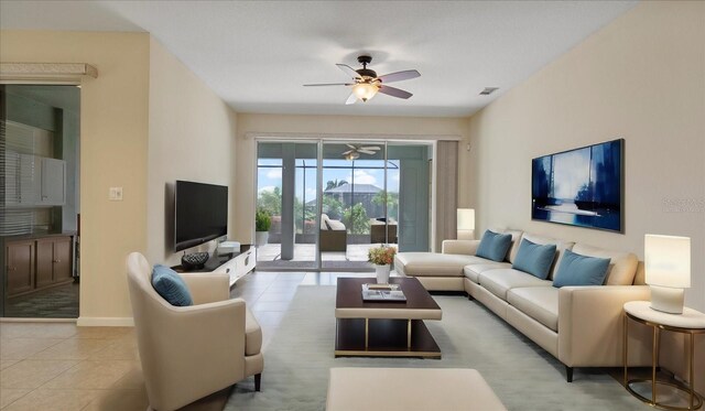 tiled living room featuring ceiling fan