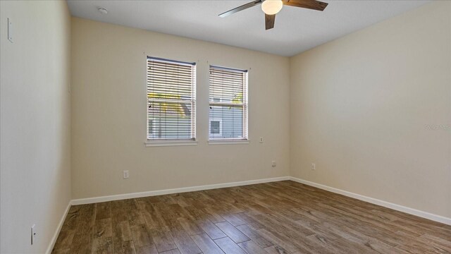 empty room featuring ceiling fan and hardwood / wood-style floors