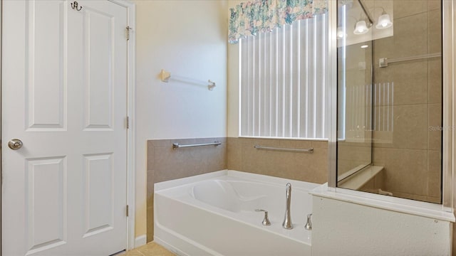 bathroom featuring separate shower and tub and tile patterned floors