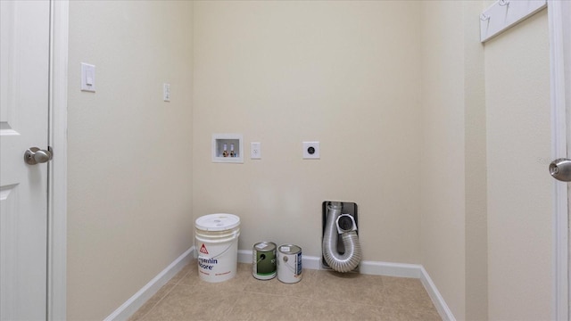 clothes washing area with washer hookup, light tile patterned floors, and electric dryer hookup