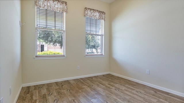 empty room with light hardwood / wood-style floors