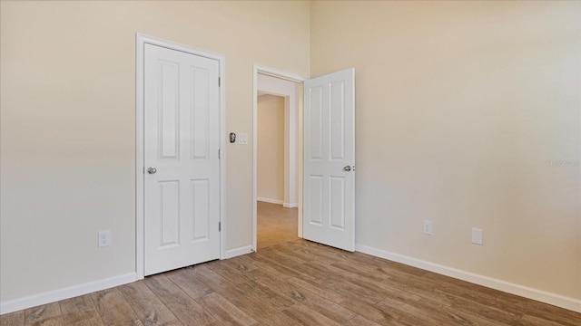 empty room with wood-type flooring