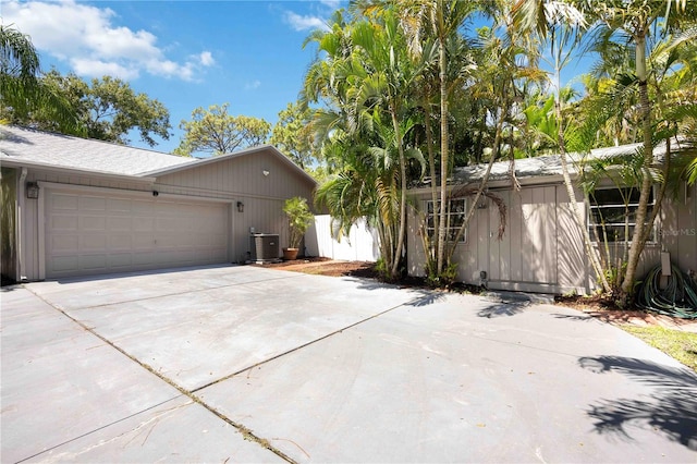 view of side of home with a garage