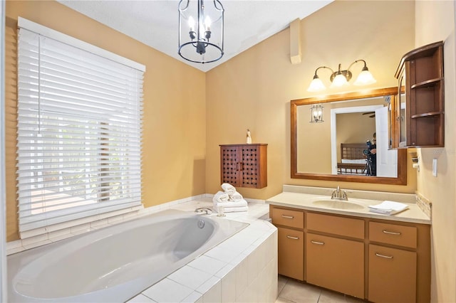 bathroom featuring vanity, a chandelier, tile patterned floors, and tiled bath