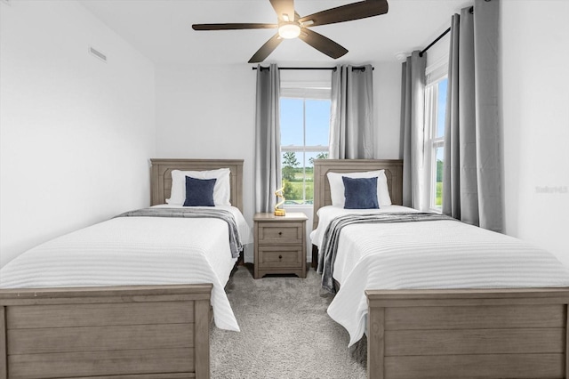 carpeted bedroom featuring ceiling fan