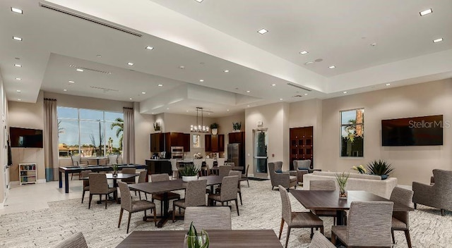 dining area with an inviting chandelier, visible vents, and recessed lighting