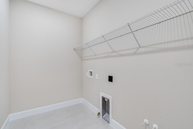 laundry area featuring gas dryer hookup, laundry area, baseboards, and washer hookup