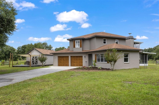 view of front facade with a front yard and a garage