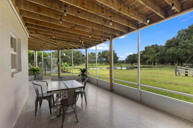 sunroom featuring wood ceiling