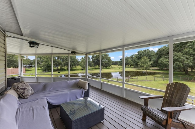 sunroom with a water view