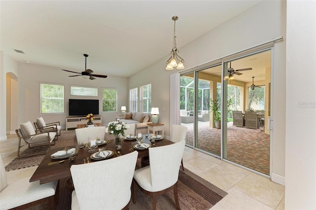 dining area featuring plenty of natural light, light tile patterned flooring, and ceiling fan