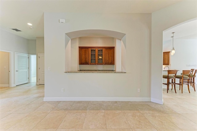 empty room with light tile patterned floors