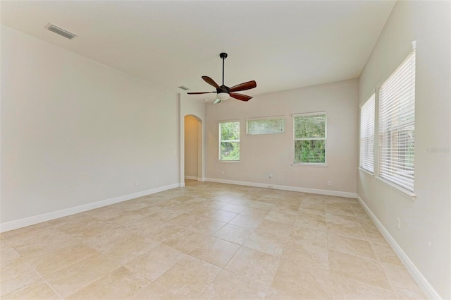 unfurnished room with ceiling fan and light tile patterned floors