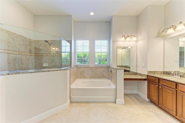 bathroom featuring tile patterned flooring, vanity, and shower with separate bathtub