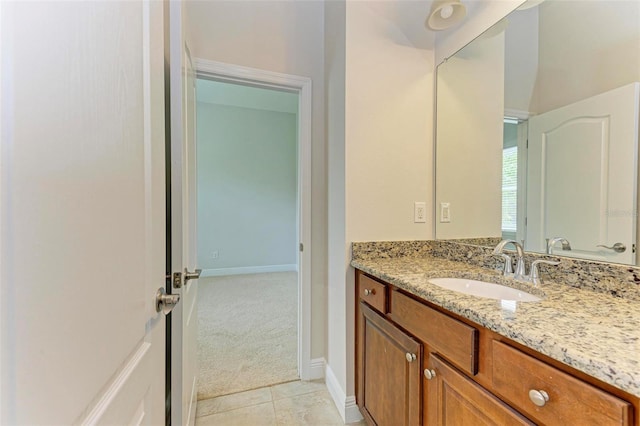 bathroom featuring tile patterned flooring and vanity