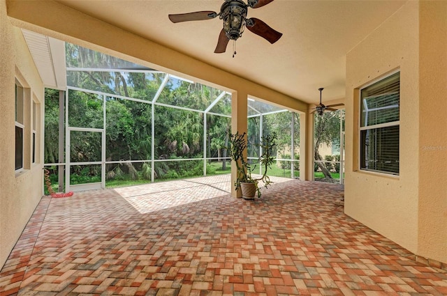 view of patio / terrace featuring ceiling fan and a lanai