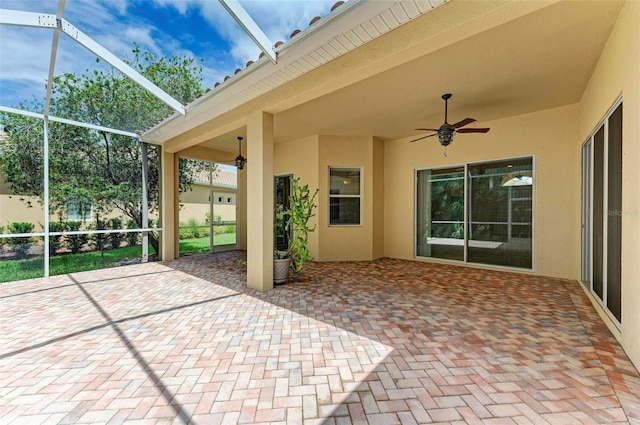 view of patio / terrace featuring a lanai and ceiling fan