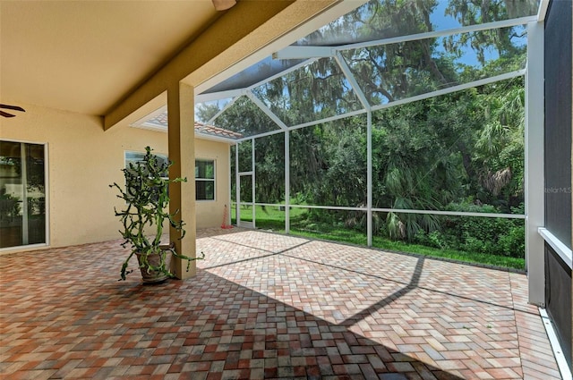 view of patio / terrace featuring glass enclosure