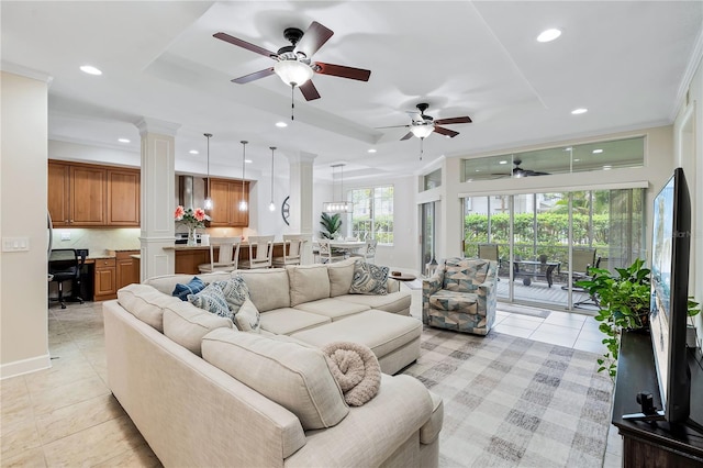 living room with ornamental molding, ornate columns, light tile patterned floors, and ceiling fan