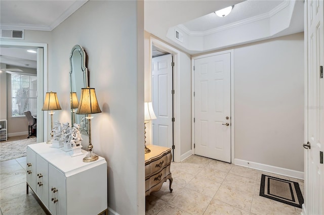 entryway with ceiling fan, light tile patterned floors, and crown molding