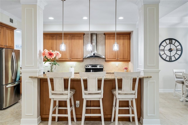 kitchen featuring stainless steel appliances, visible vents, backsplash, wall chimney exhaust hood, and decorative columns