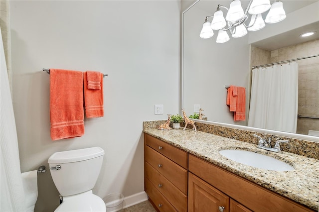 bathroom featuring vanity, toilet, and a shower with curtain