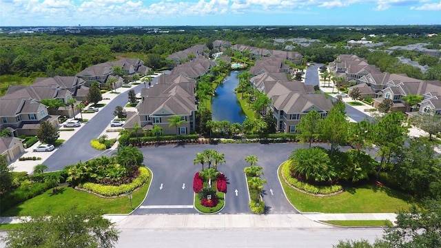 bird's eye view with a water view and a residential view