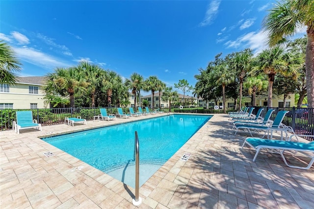 view of swimming pool with a patio