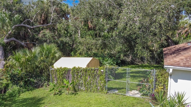 view of yard with a gate and fence