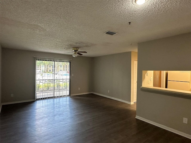 unfurnished room with dark hardwood / wood-style flooring, ceiling fan, and a textured ceiling