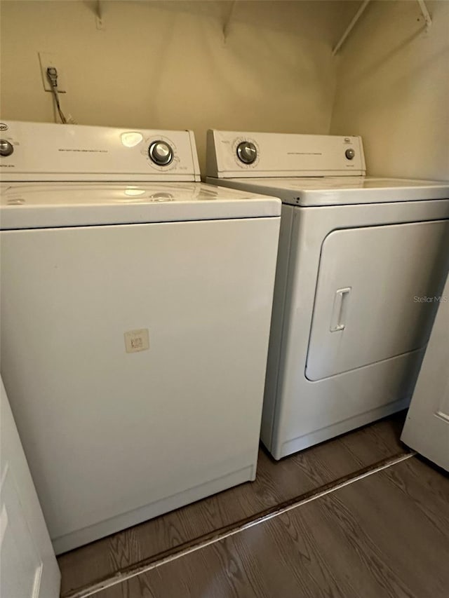 laundry room featuring hardwood / wood-style flooring and independent washer and dryer