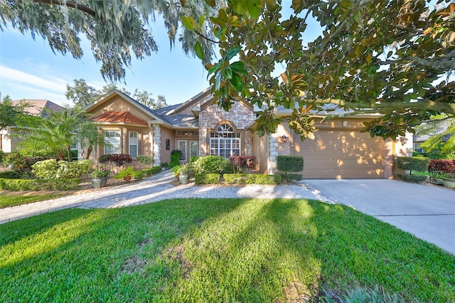 view of front of house featuring a front yard and a garage