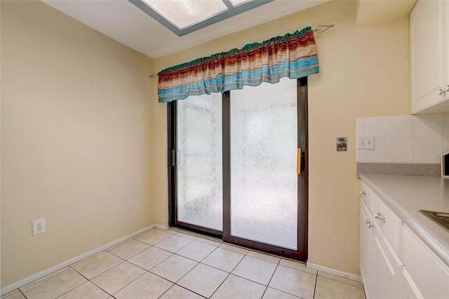 interior space with light tile patterned floors