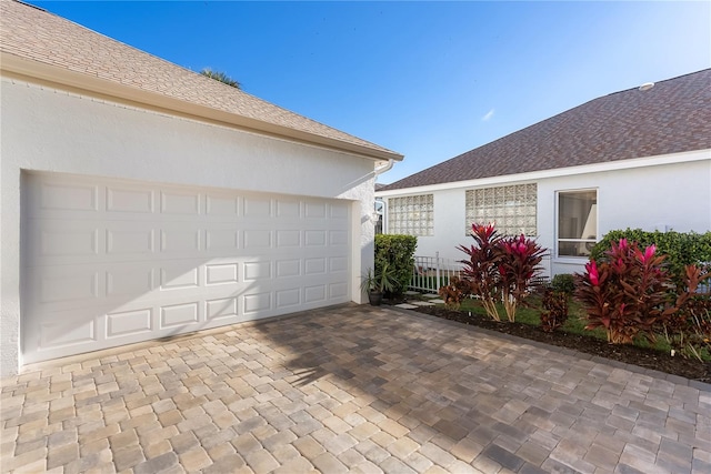 view of property exterior with a garage