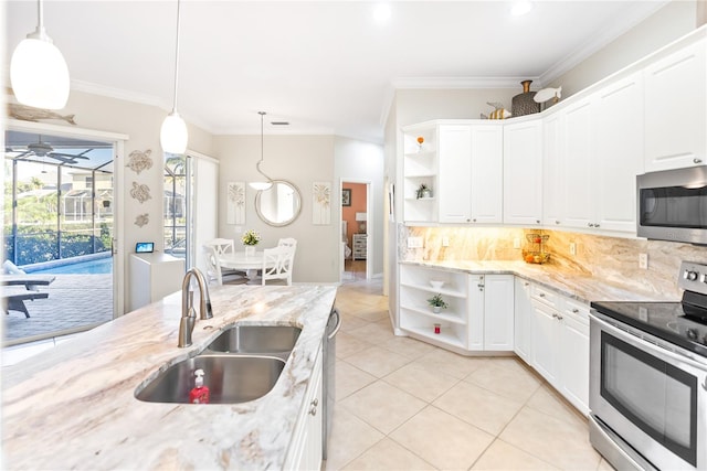 kitchen with decorative light fixtures, light stone countertops, stainless steel appliances, sink, and ceiling fan