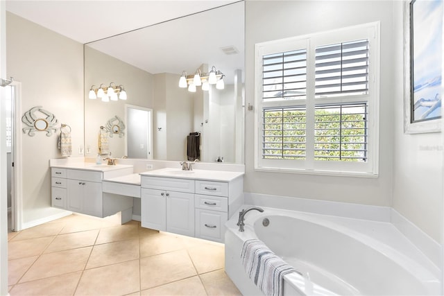 bathroom featuring vanity, a bathtub, and tile patterned floors