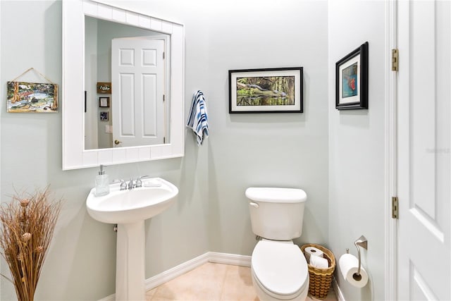 bathroom featuring toilet and tile patterned floors