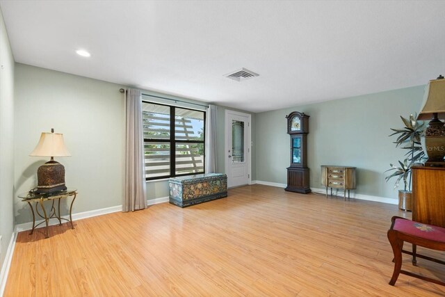 sitting room featuring light hardwood / wood-style flooring