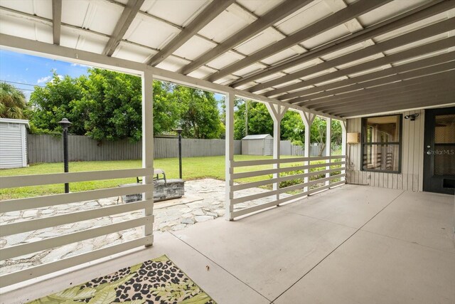 view of patio with a storage unit