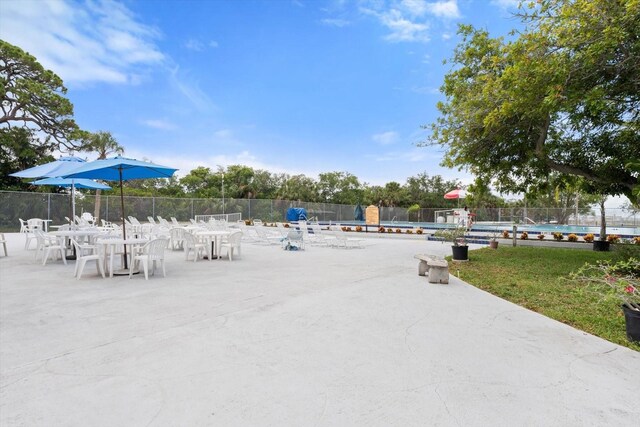 view of home's community with a patio area and a pool