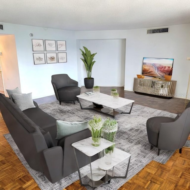 living room with parquet floors and a textured ceiling