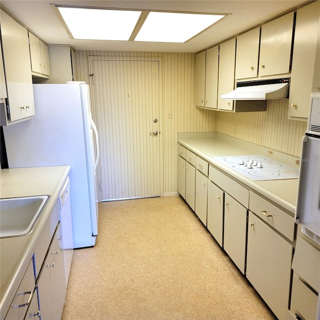 kitchen featuring sink, white cooktop, and white cabinets