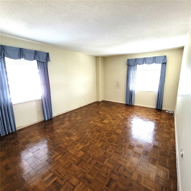 empty room with a textured ceiling