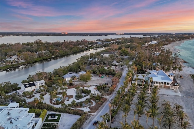 aerial view at dusk with a water view