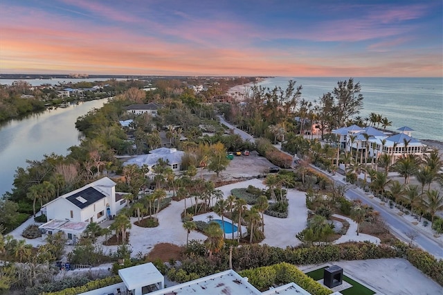 aerial view at dusk with a water view