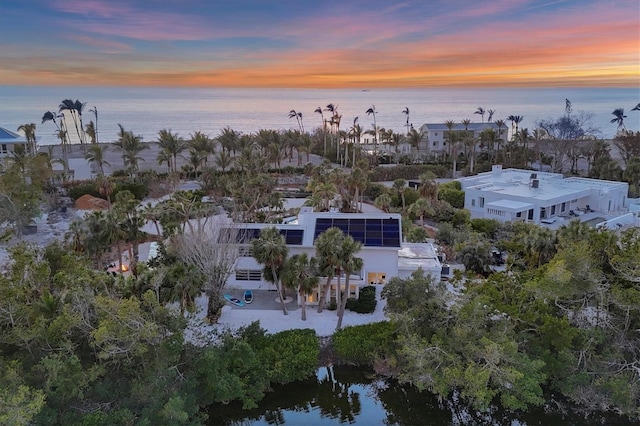 aerial view at dusk with a water view